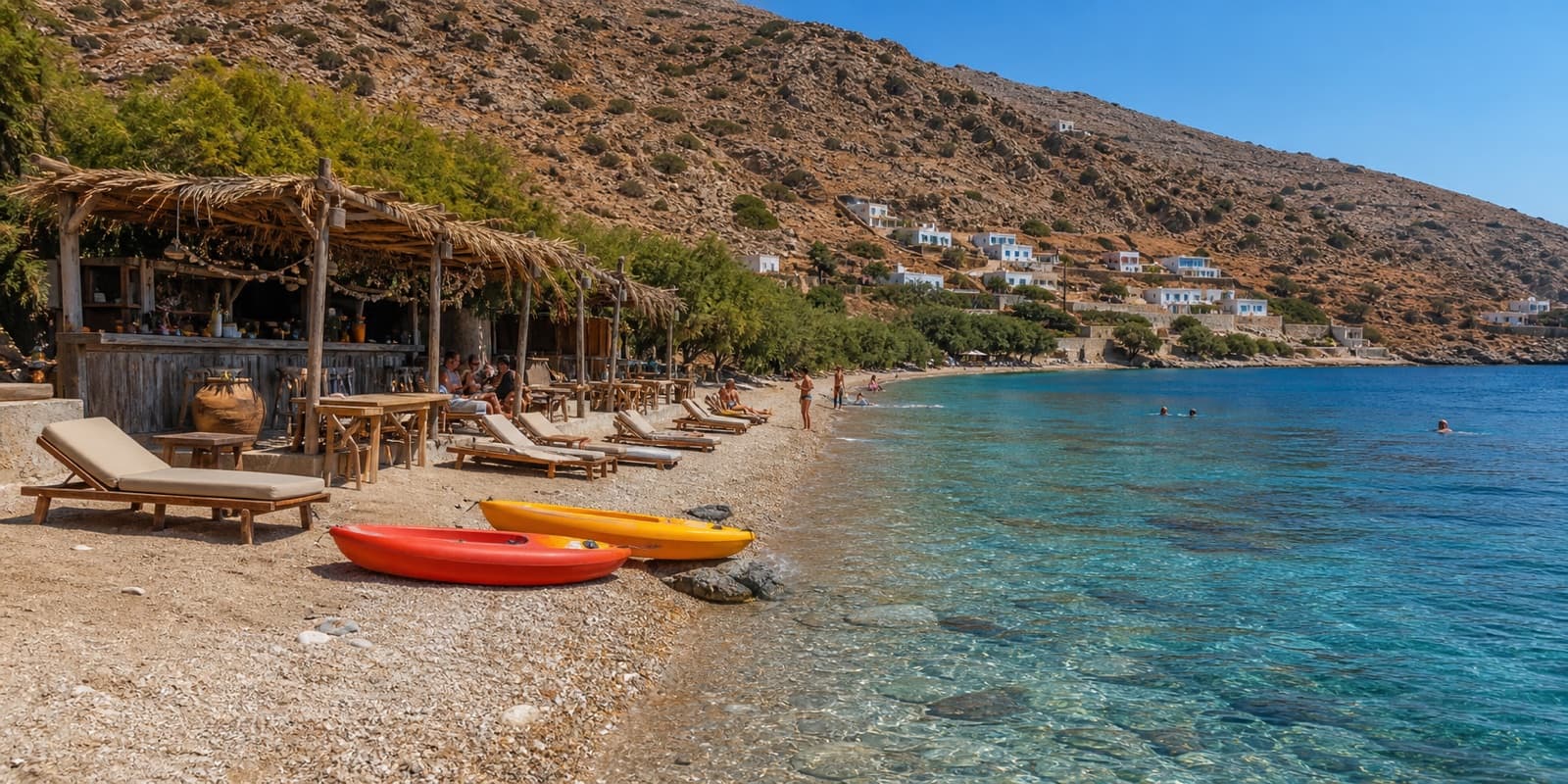A small Kalymnos beach with a driftwood beach bar