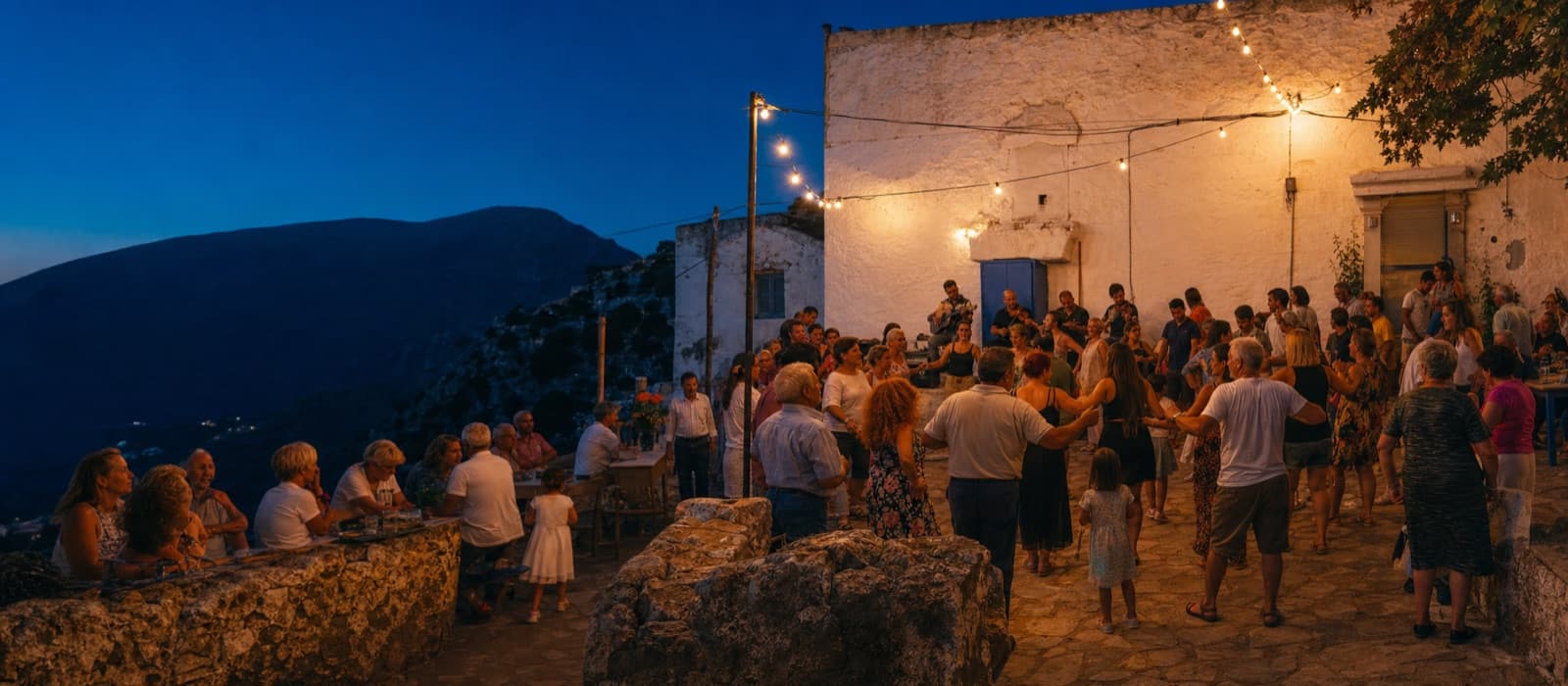 People gathering and dancing at an evening celebration on a Greek island